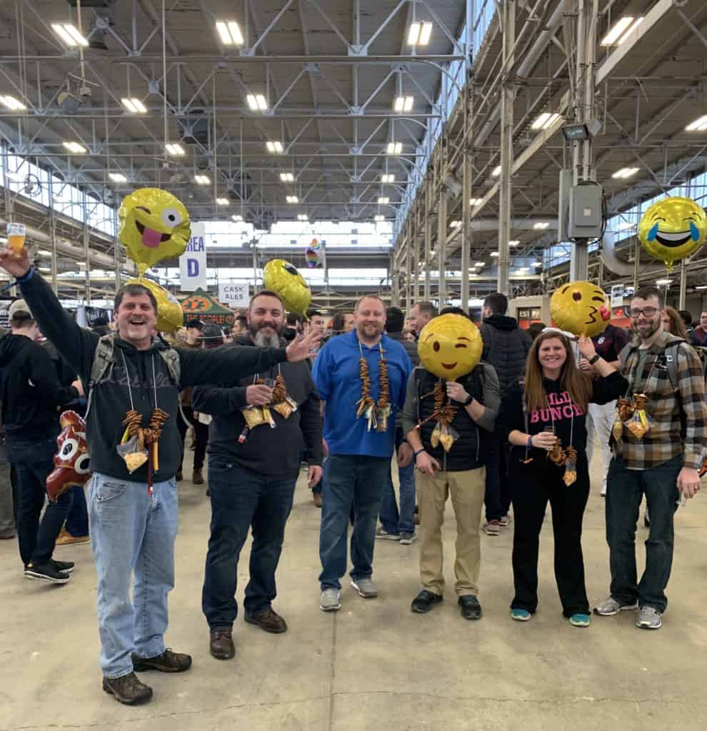 A group of Winterfest Attendees with emoji balloons