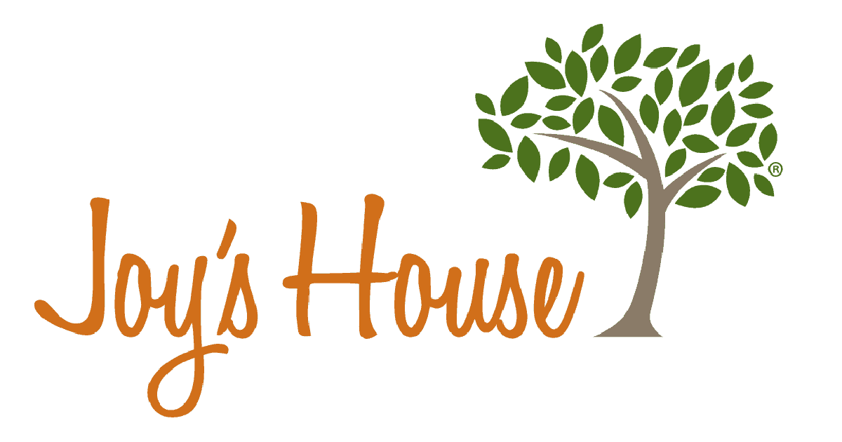 Joy's House logo orange letters with tree.